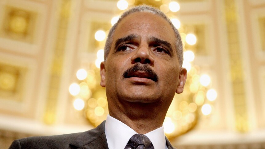 Eric Holder talks to reporters after meeting with Darrell Issa.