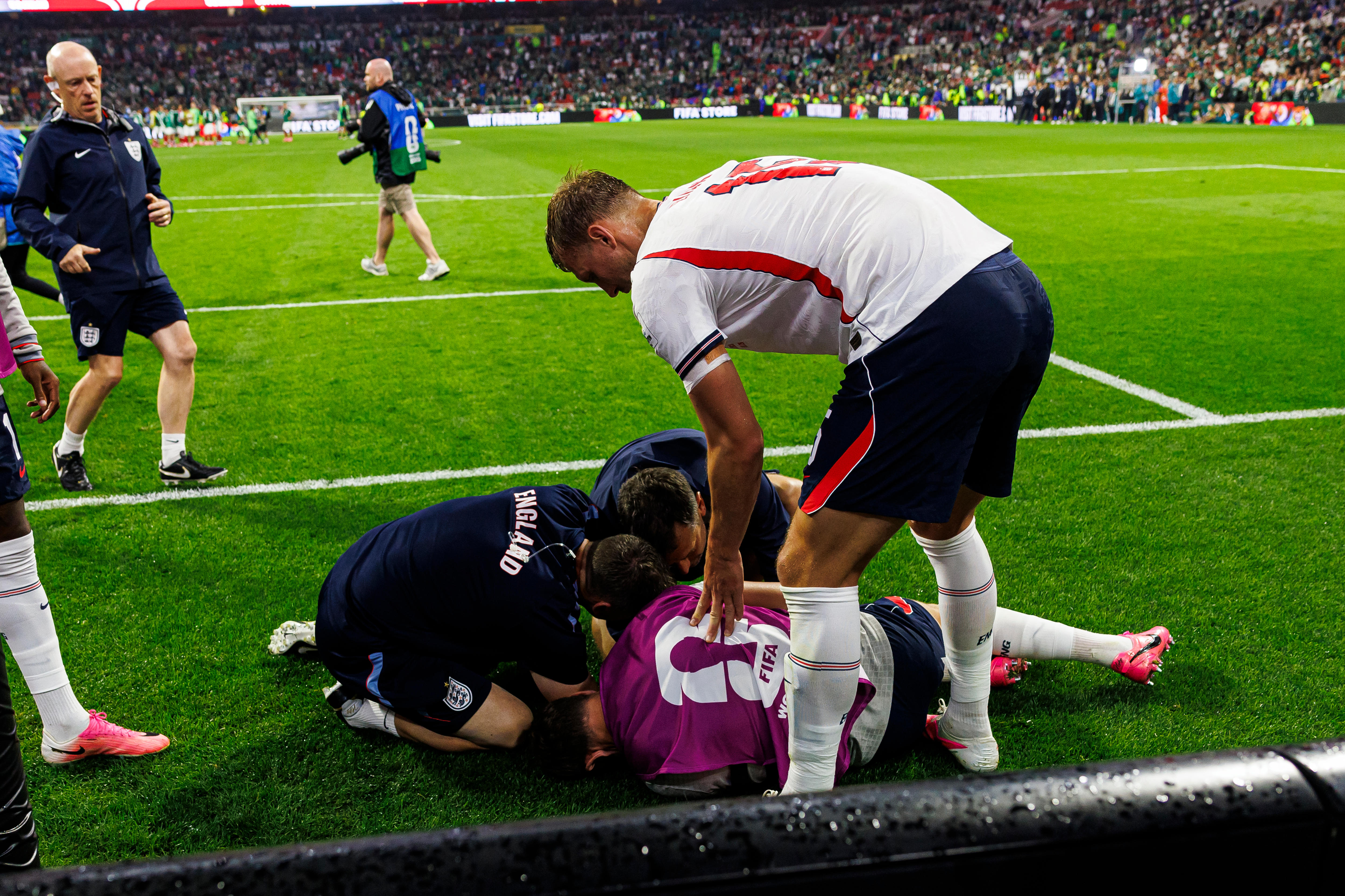 Jordan Henderson in a crumpled heap on the ground with medical staff rushing over