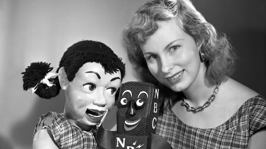 A black and white photo of Shirly Dinsdale with her puppet.