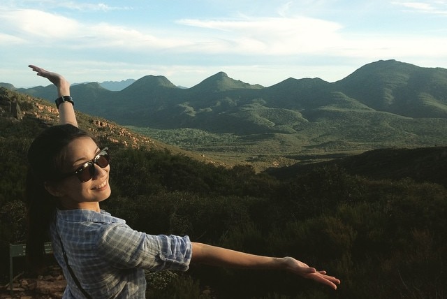 Woman in front of view at Tanderra Saddle