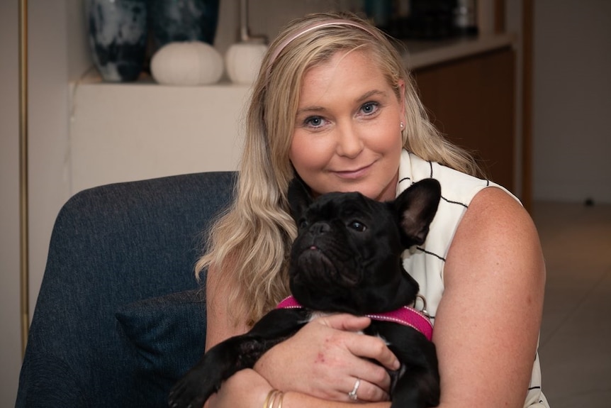 Virginia Giuffre with her therapy dog Juno, a French bulldog, in Cairns in Far North Queensland.