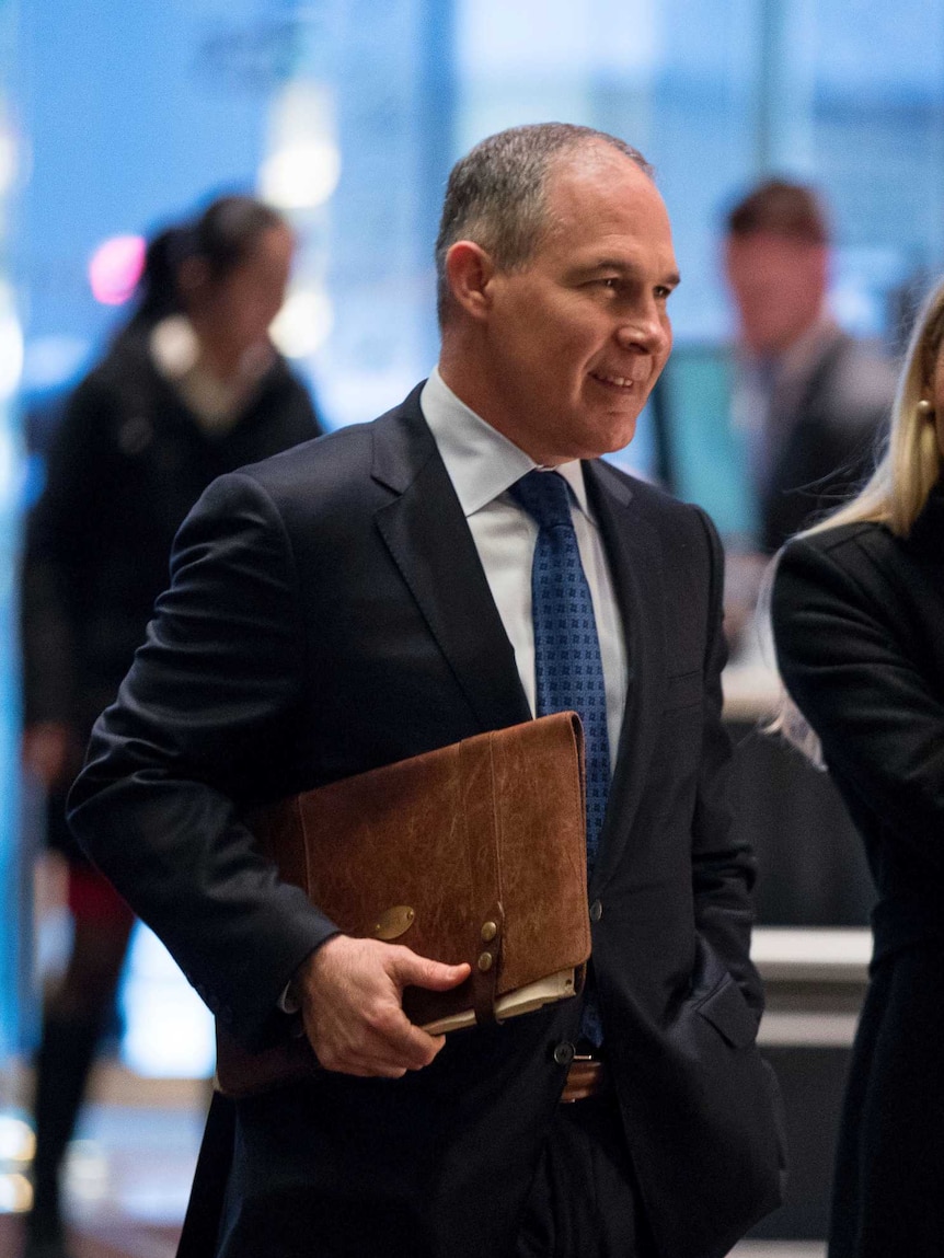 Oklahoma Attorney-General Scott Pruitt walks into Trump Tower.