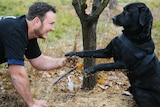 Jayson Mesman with his first rescued dog Samson hunting for truffles.