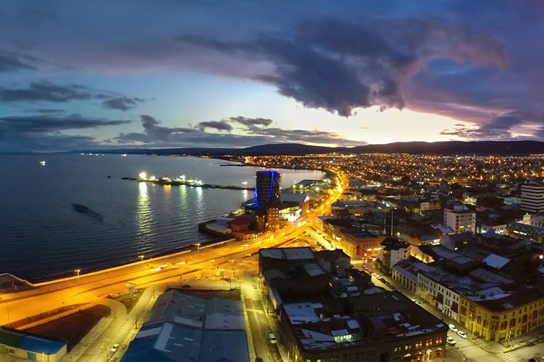 The waterfront of Punta Arenas pictured at dusk.