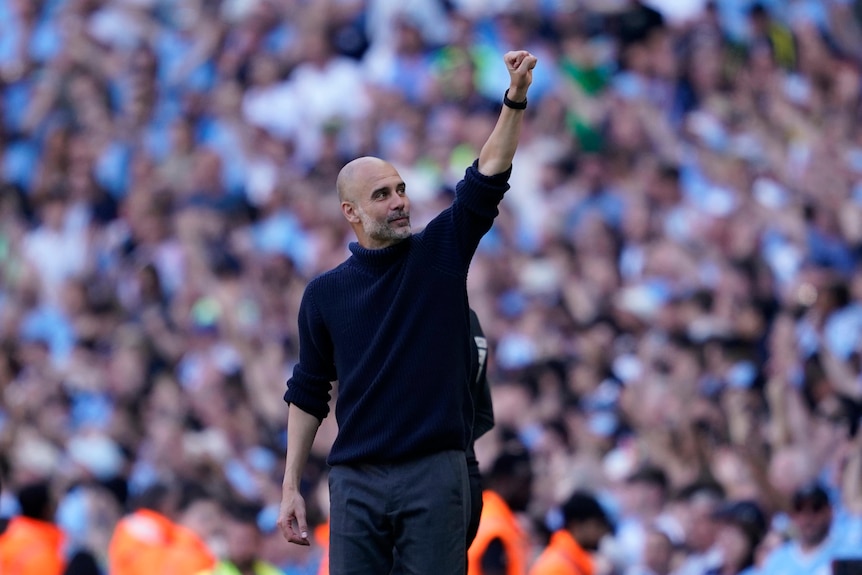 Pep Guardiola holds up his hand