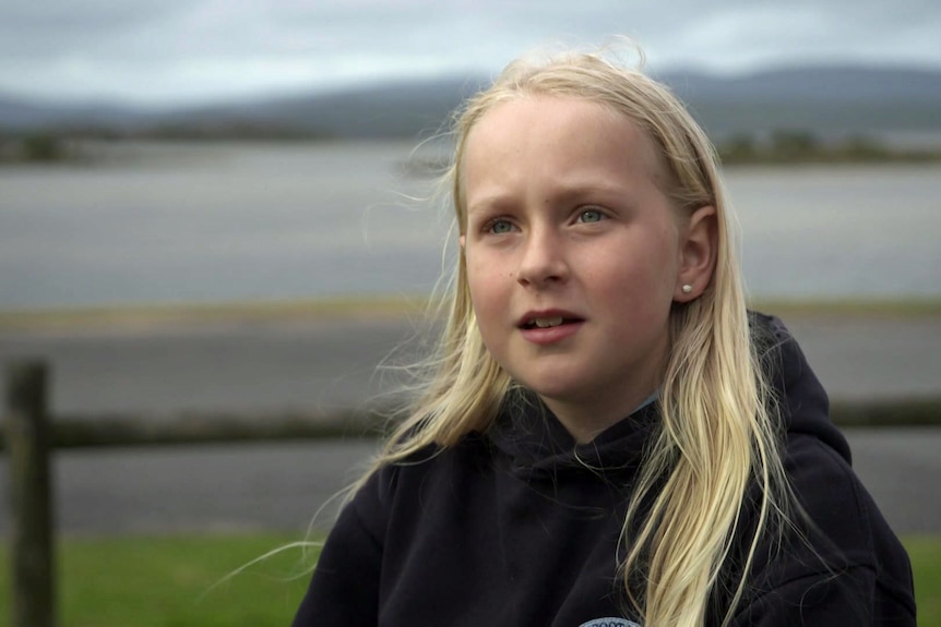 A girl with long blonde hair.