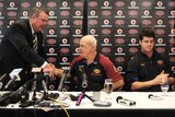 Jonathan Brown applaudes as coach Leigh Matthews shakes hands with Tony Kelly