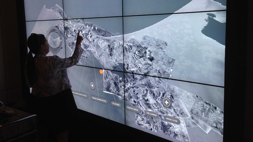 Staff testing an interactive exhibit in newly refurbished First World War Galleries at the Australian War Memorial.