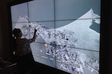 Staff testing an interactive exhibit in newly refurbished First World War Galleries at the Australian War Memorial.