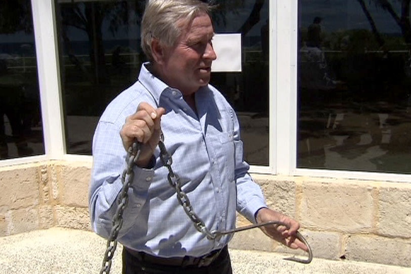 ThenWA Premier Colin Barnett holds shark hook.