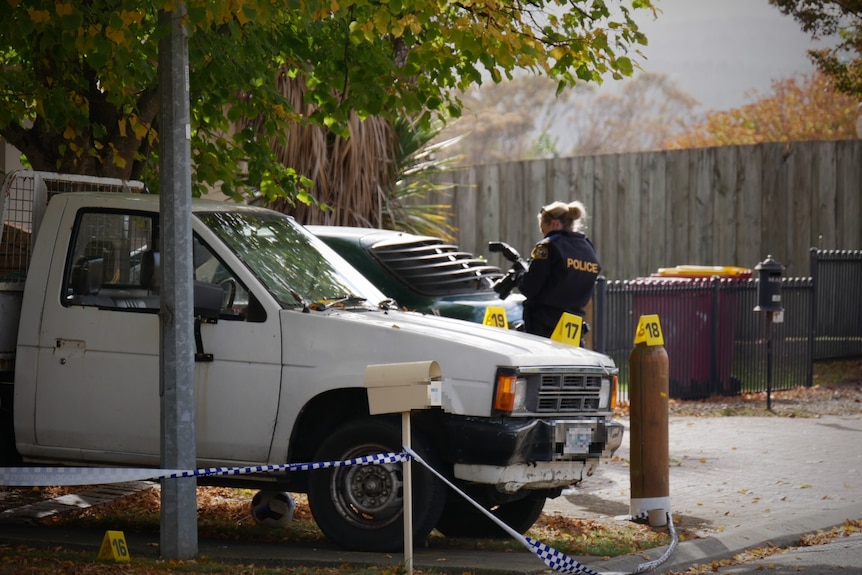 Police photographer at scene of shooting.