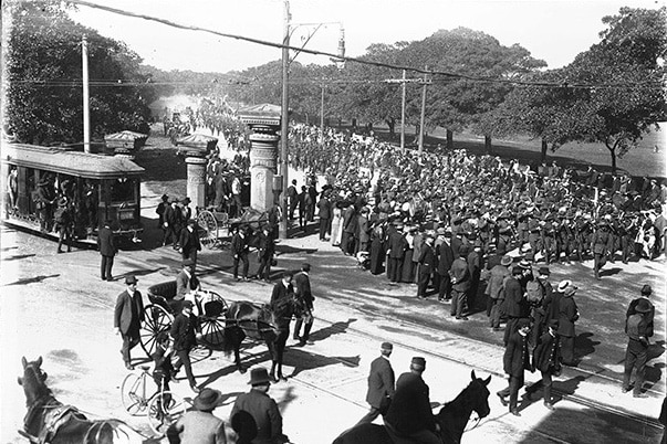 Historic photo shows figs lining Anzac Parade, Moore Park as troops march on their way to board a war ships at Circular Quay.