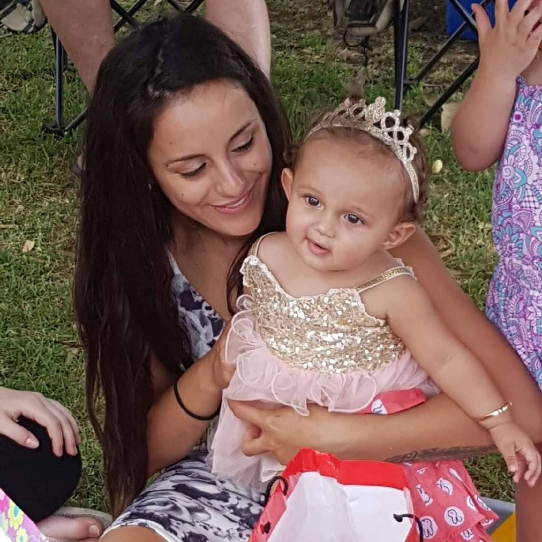 A woman holding a baby