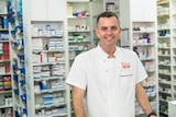 A man standing in a pharmacy.