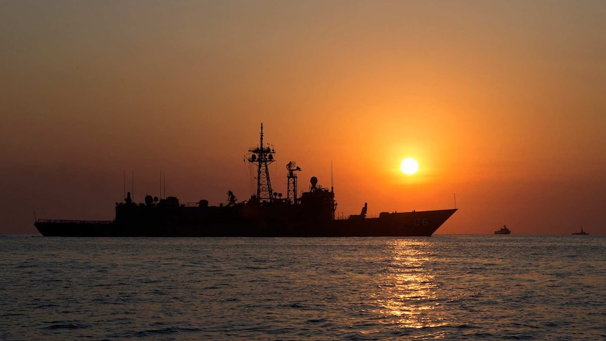 Royal Australian Navy ship, HMAS Newcastle, at sunrise during Exercise Kakadu 2018.