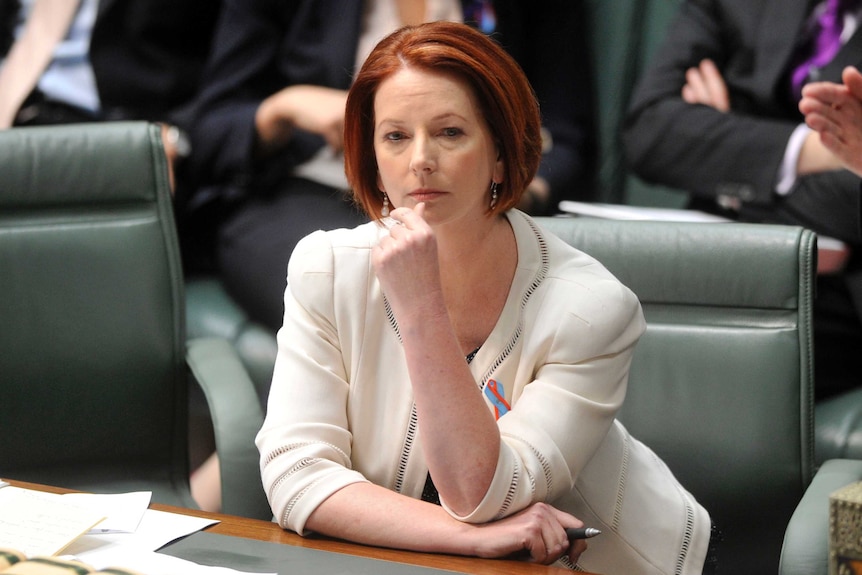 Prime Minister Julia Gillard listens during question time.
