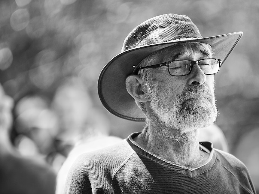 Photo from Men with Heart exhibition, a black and white photo of bearded man in hat.