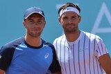 Grigor Dimitrov (right) and Borna Coric embrace at the net before a match on the Adria Tour.