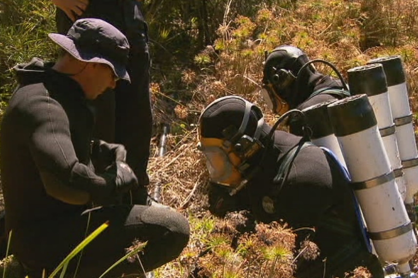 Police divers in scuba gear