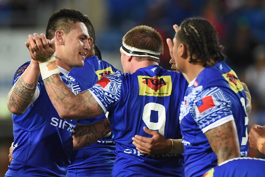 Samoa's Daniel Vidot celebrates with Josh McGuire