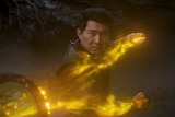 Man with light on his hands from an action movie