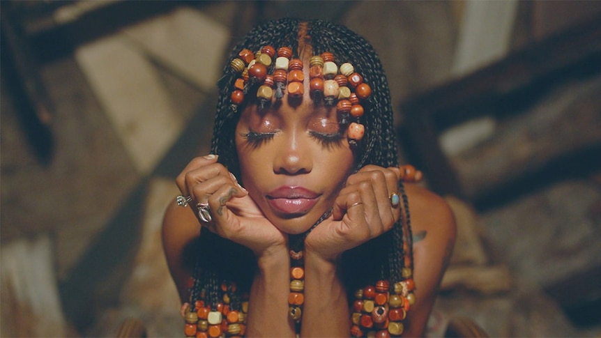 A still of SZA with hair braids from the 2020 music video 'Hit Different'
