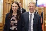 Jacinda Ardern and Chris Hipkins walk through Parliament House in Wellington on their way to Sunday's caucus vote.