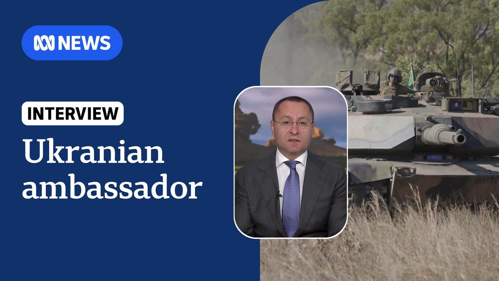 Ukranian ambassador: Khaki camouflaged tank in dust inset with image of Ukranian ambassador. 