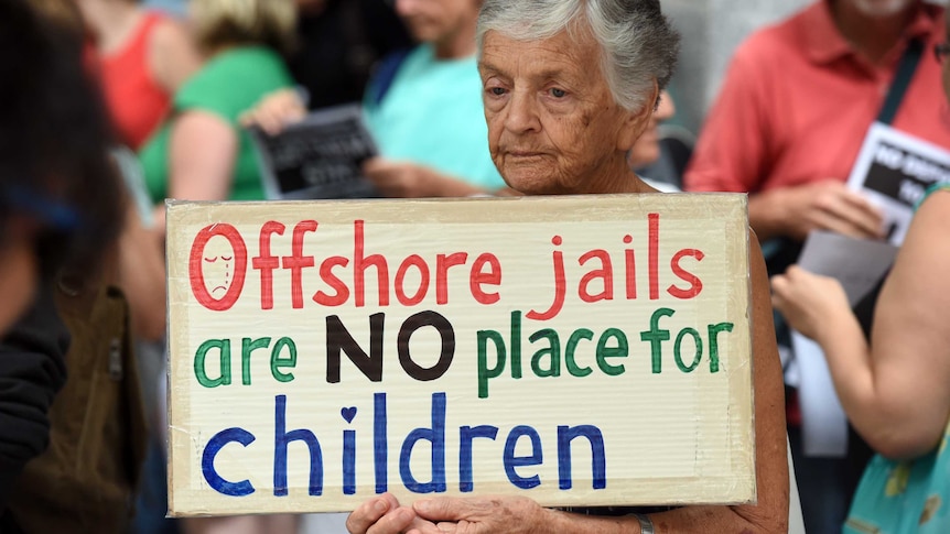 Pro-refugees protesters rally outside the Brisbane Immigration Office