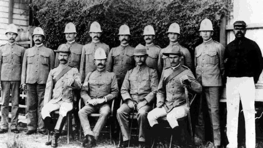 Undated photo of Indigenous tracker Corporal Sam Johnson (far right) with Queensland police colleagues in the 1900s