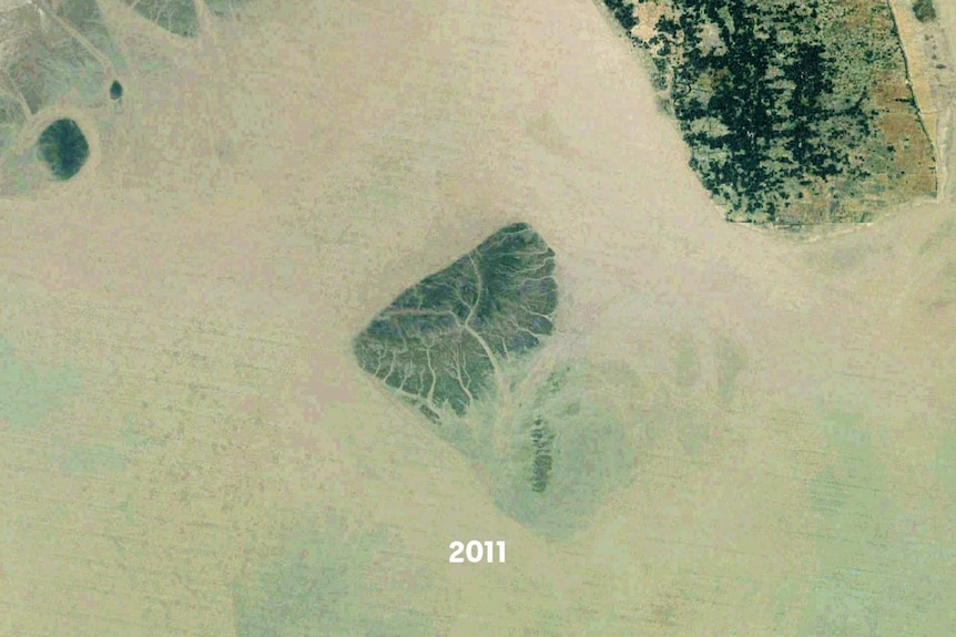 A satellite images of a small island, part of it is underwater