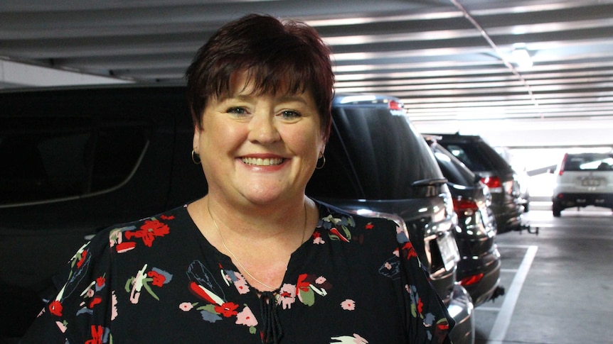 A woman in a multi-storey car park