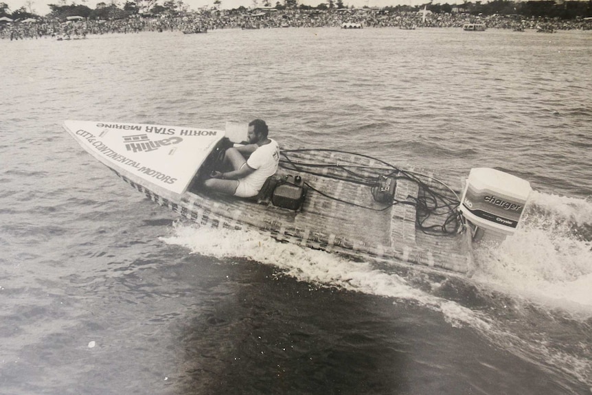 Beer Can Regatta creator Lutz Frankenfeld in a motorised beer can boat off the Darwin coast.