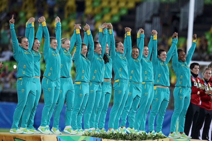Australia celebrates on podium after winning rugby sevens gold
