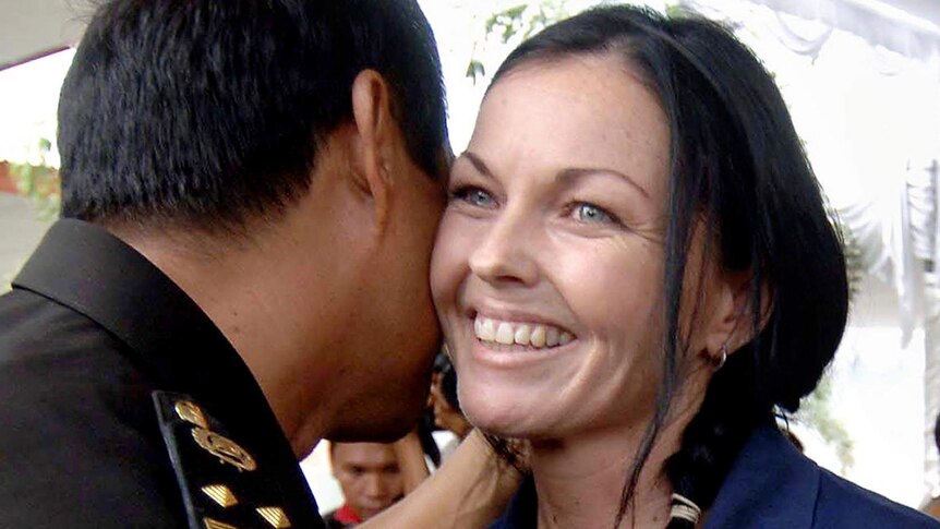 Schapelle Corby is greeted by a prison official during a ceremony inside Kerobokan prison.