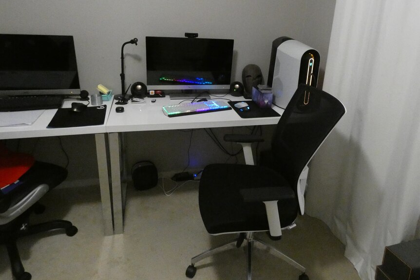 A desktop computer set-up with an office chair