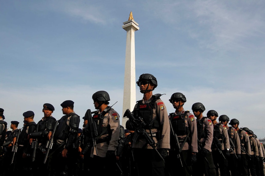 Armed anti-riot police stand during security preparations