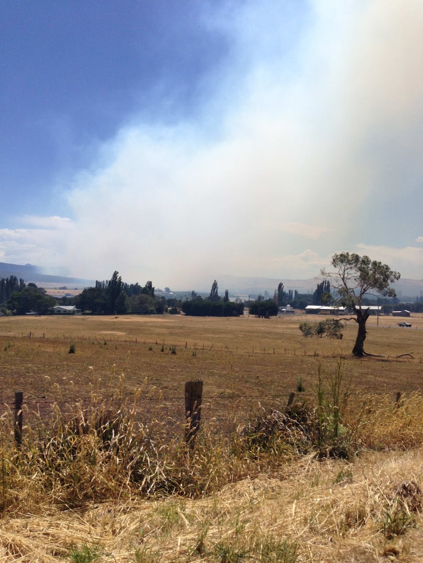 Smoke from the bushfire burning near Lake Repulse in the Upper Derwent Valley seen from near Ouse