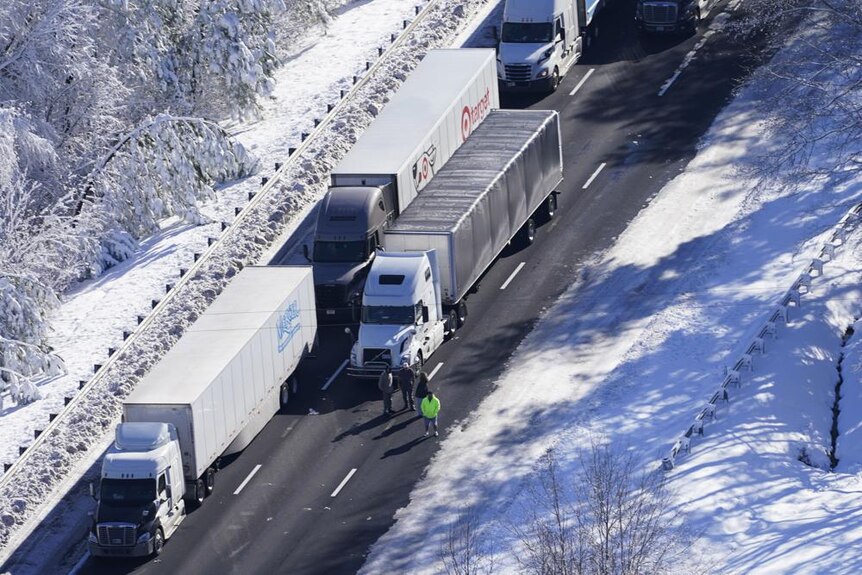 Long haul trucks stranded on highway on an icy section of highway 