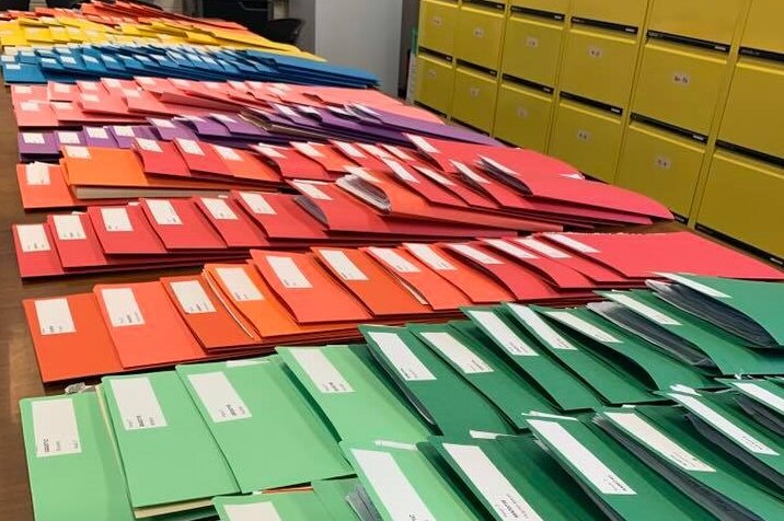 Rows of different coloured manila folders