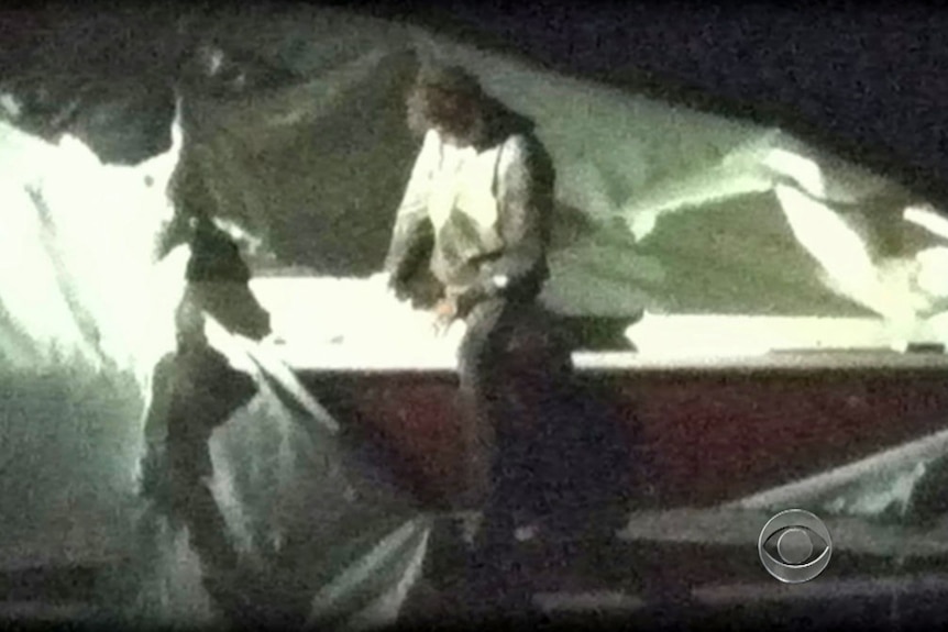 Dzhokhar Tsarnaev in front of boat