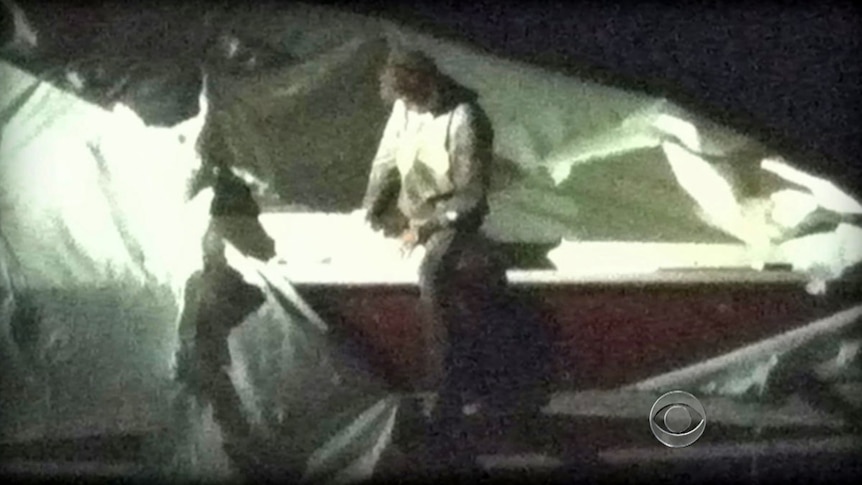 Dzhokhar Tsarnaev in front of boat