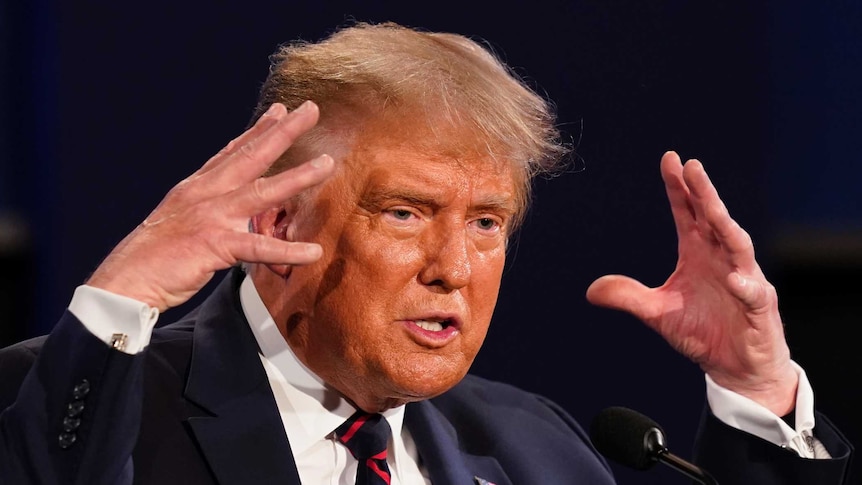 President Donald Trump gestures while speaking during the first presidential debate