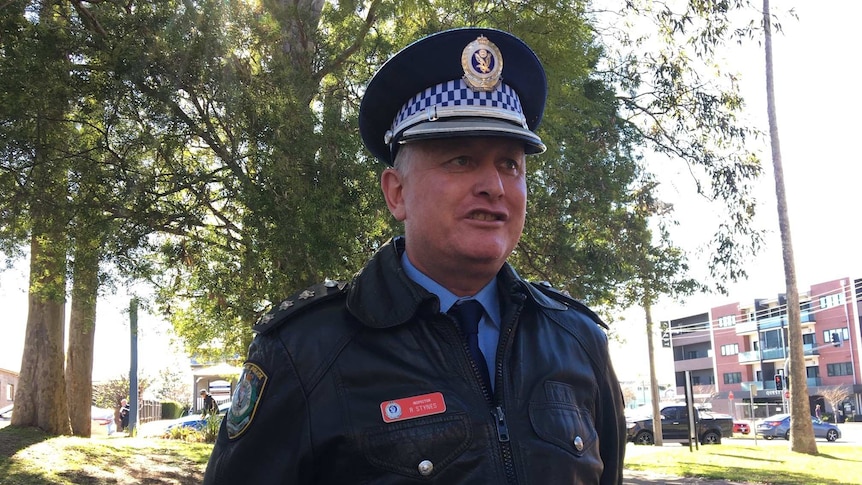 A police officer speaking to the media.