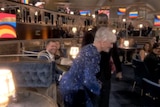 Glenn Close dancing in a sparkly blue dress at the 2021 Oscars ceremony.