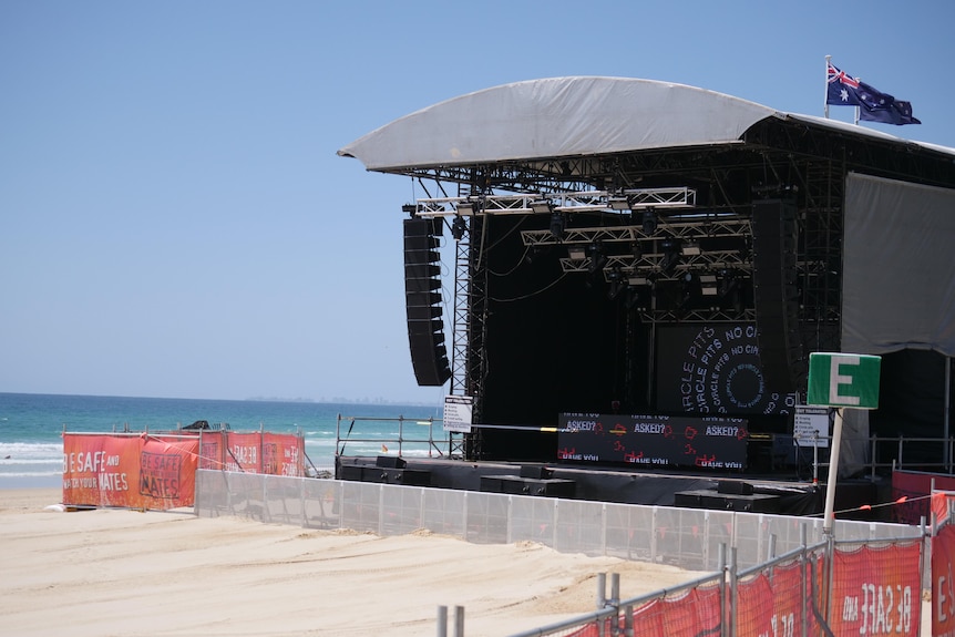 An empty stage set up on a beach
