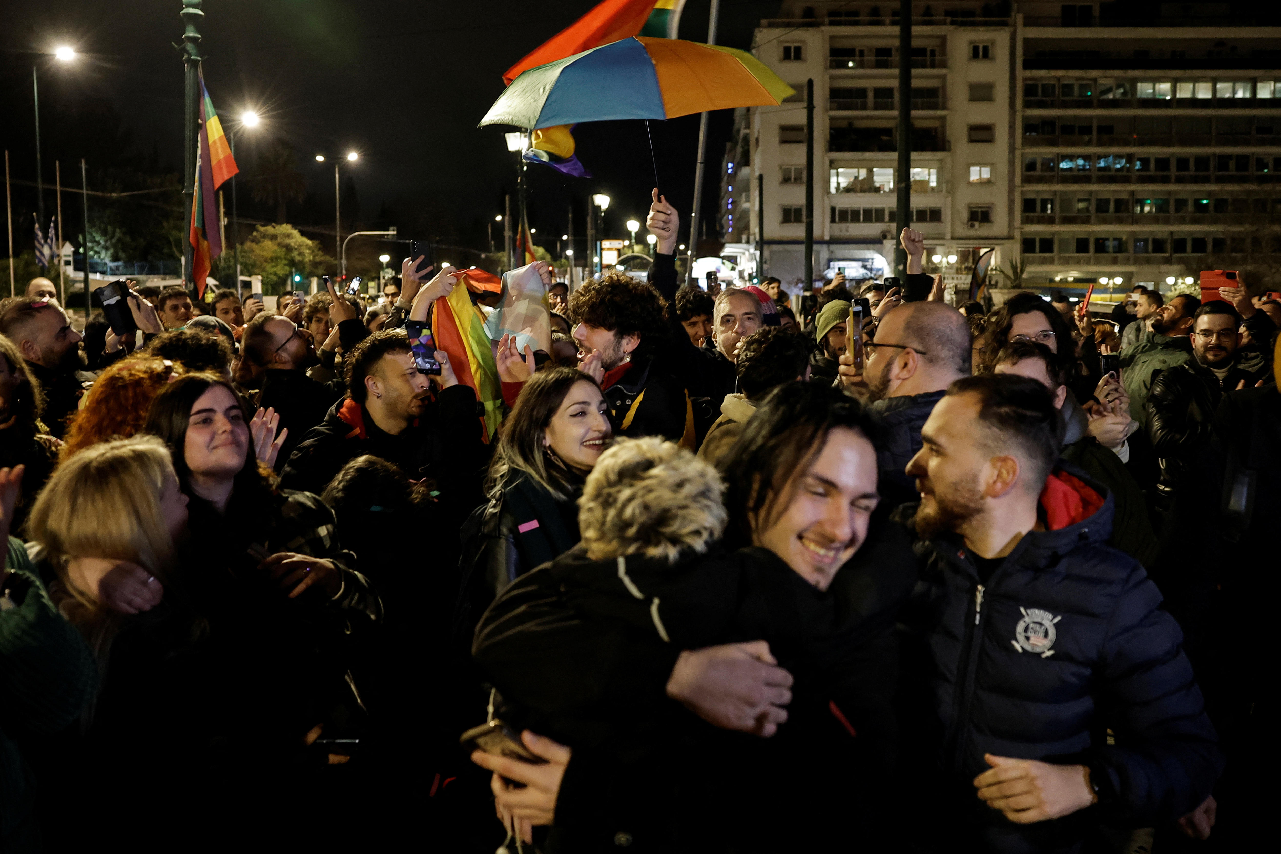 Members of the LGBT community and supporters of the bill celebrated in front of the Greek parliament.