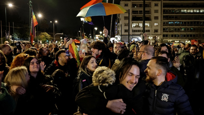 Members of the LGBT community and supporters of the bill celebrated in front of the Greek parliament.