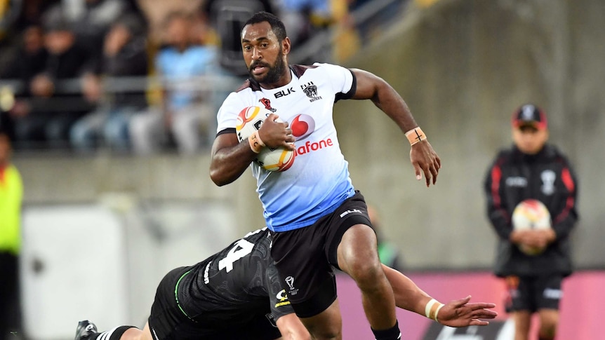Henry Raiwalui of Fiji tackled by Nelson Asofa-Solomona of New Zealand.