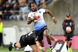 Henry Raiwalui of Fiji tackled by Nelson Asofa-Solomona of New Zealand.